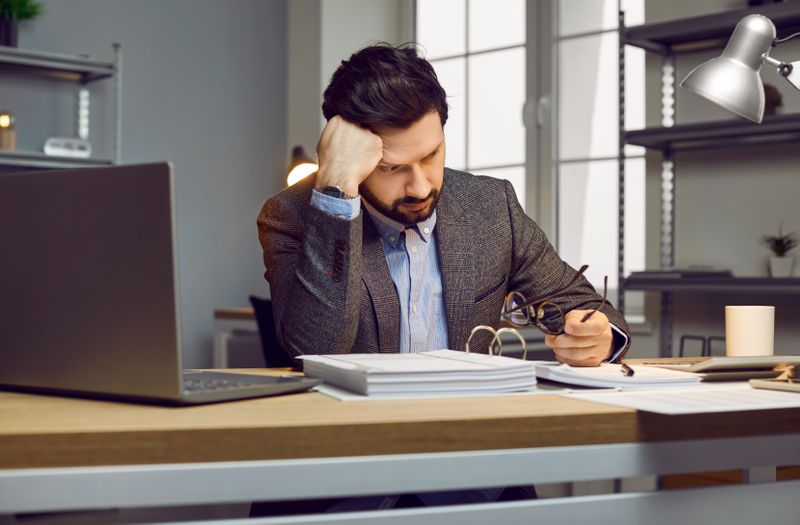 Accountancy office worker looking tired and pale