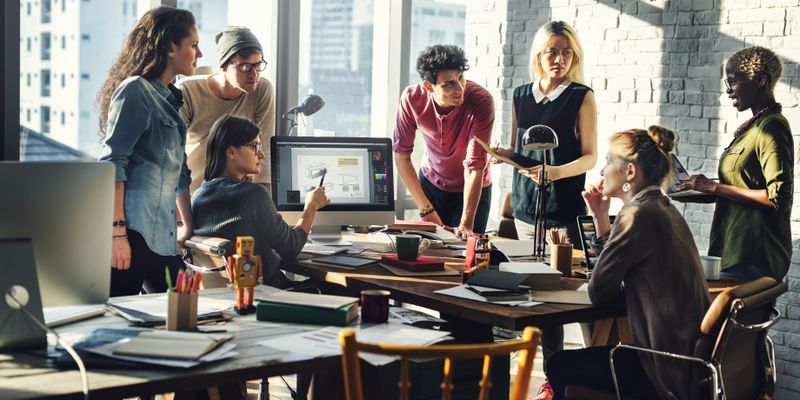 Group of people brainstorming in office